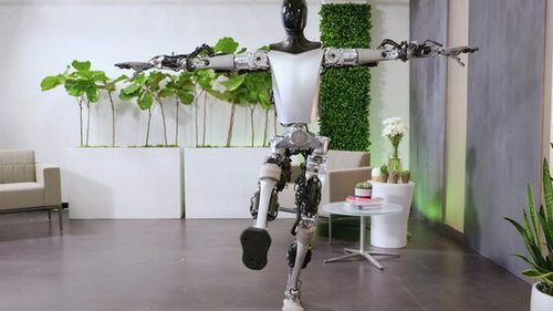 Tesla показала, как двуногий робот Optimus стоит на одной ноге и сорти...