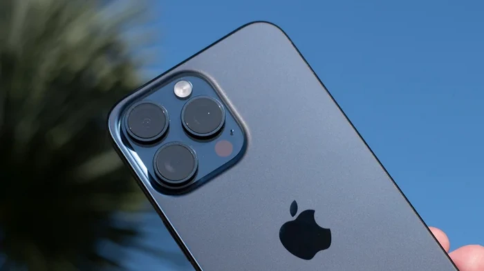 Apple iPhone 15 Pro Max rear against blue sky